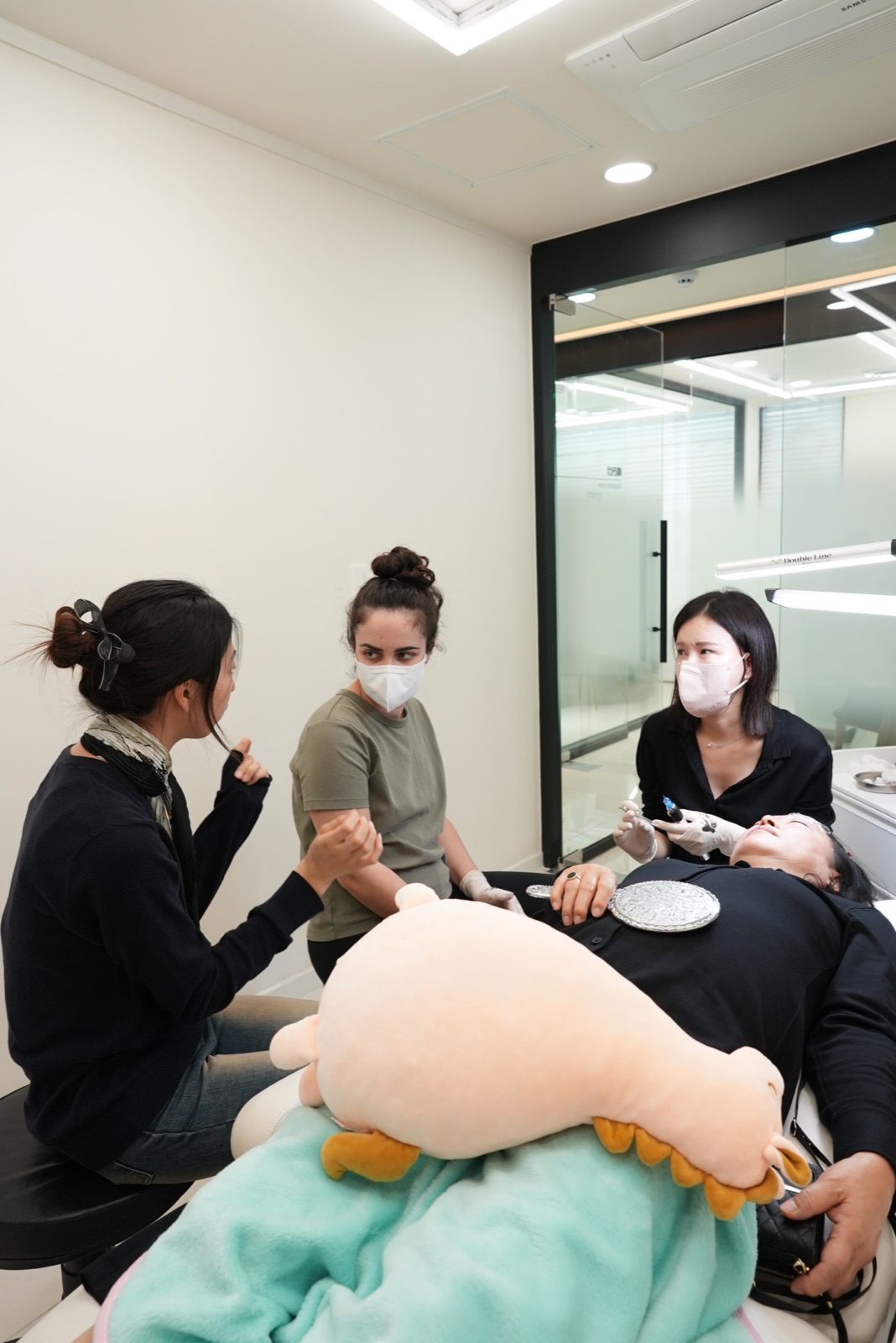 Students practicing a hair treatment technique